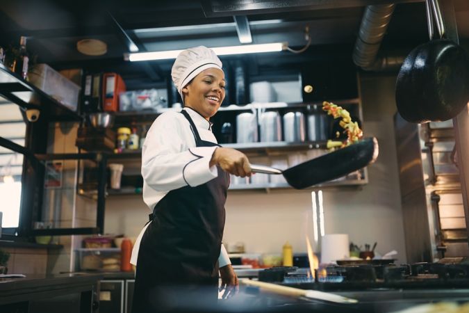 African,American,Female,Chef,Having,Fun,While,Preparing,Food,In